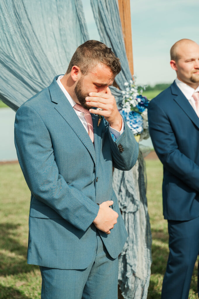 groom reacting to the bride