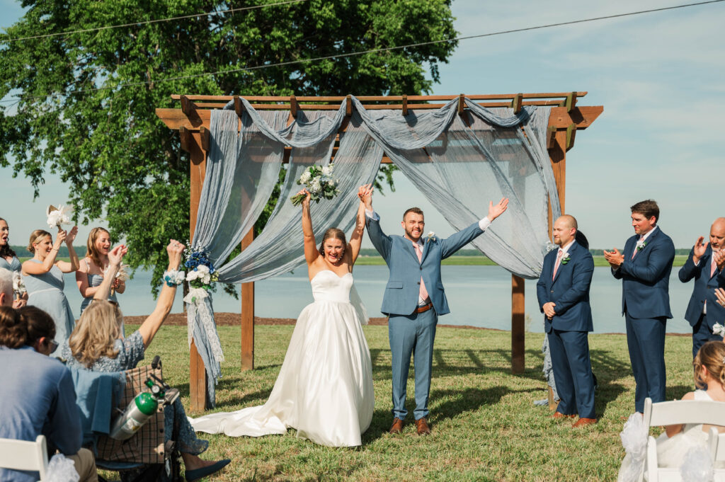 bride and groom celebrating at end of ceremony