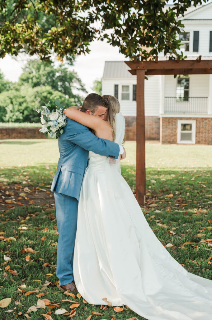 bride and groom hugging after ceremony