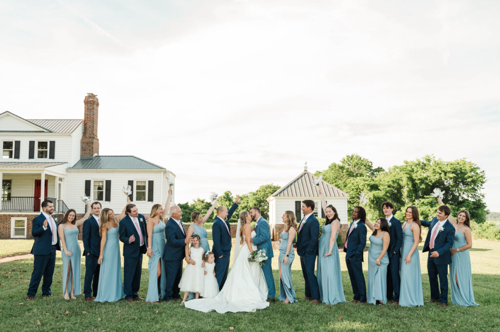 wedding party cheering for bride and groom