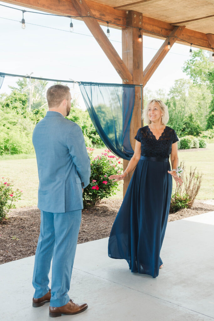 first look - groom with mom