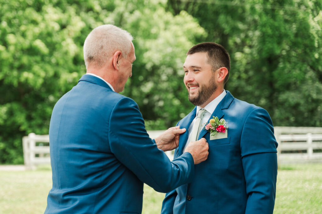 Groom’s dad helping get ready 