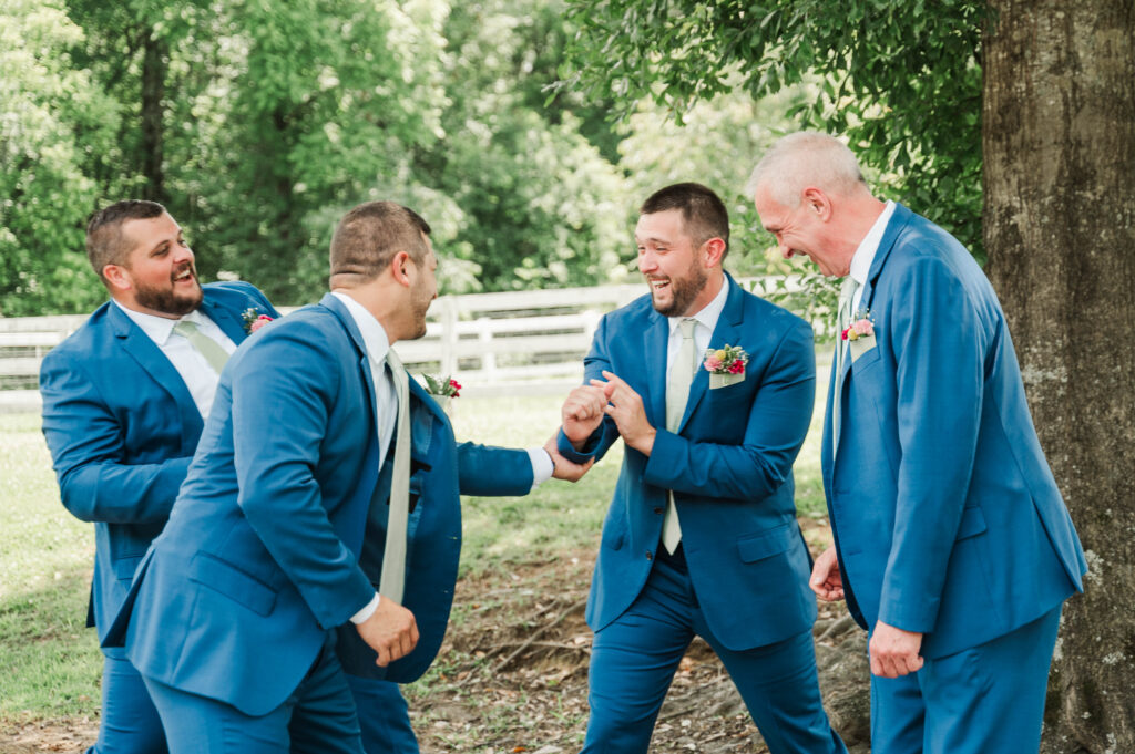 Groomsmen giving groom a hard time 