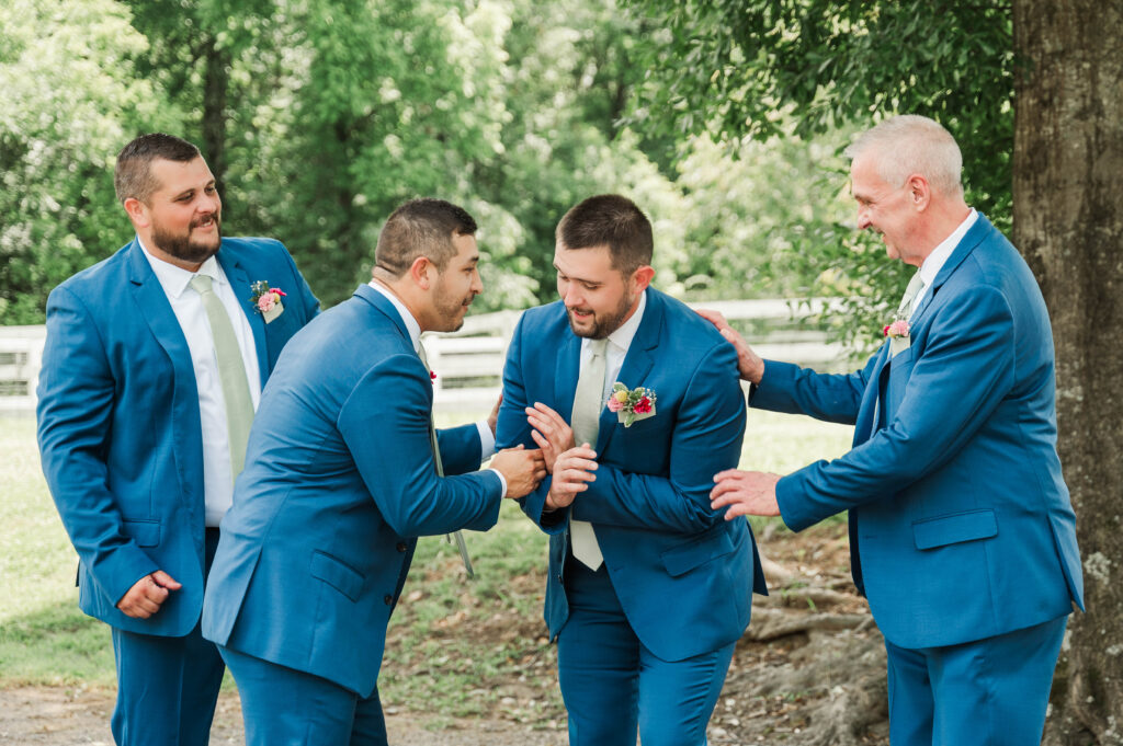 Groomsmen giving groom a hard time