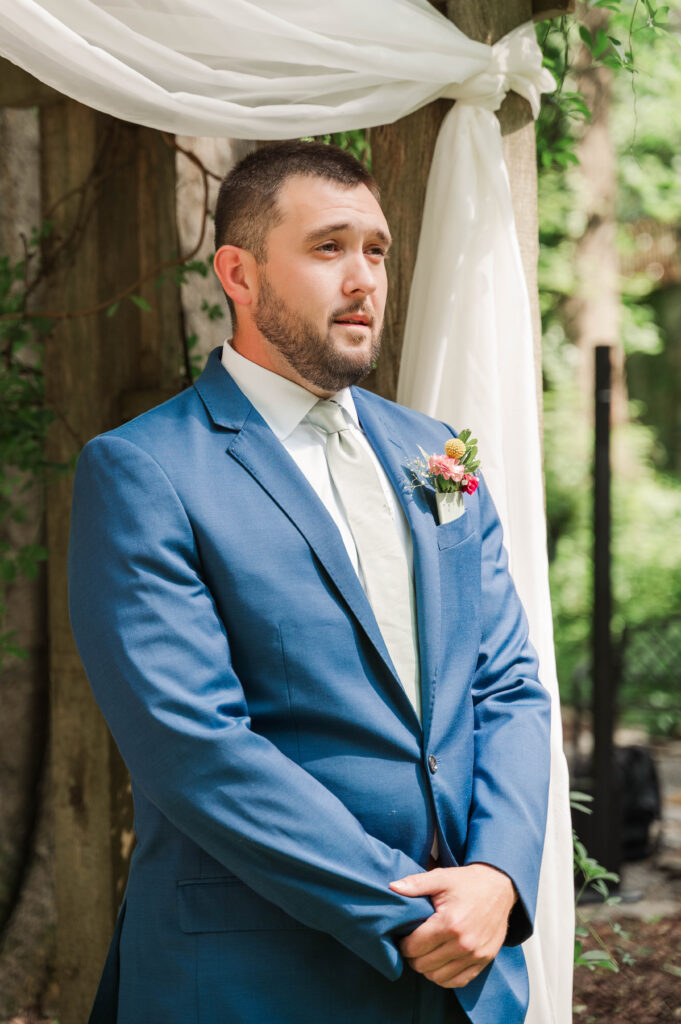 Groom sees bride coming down the aisle 