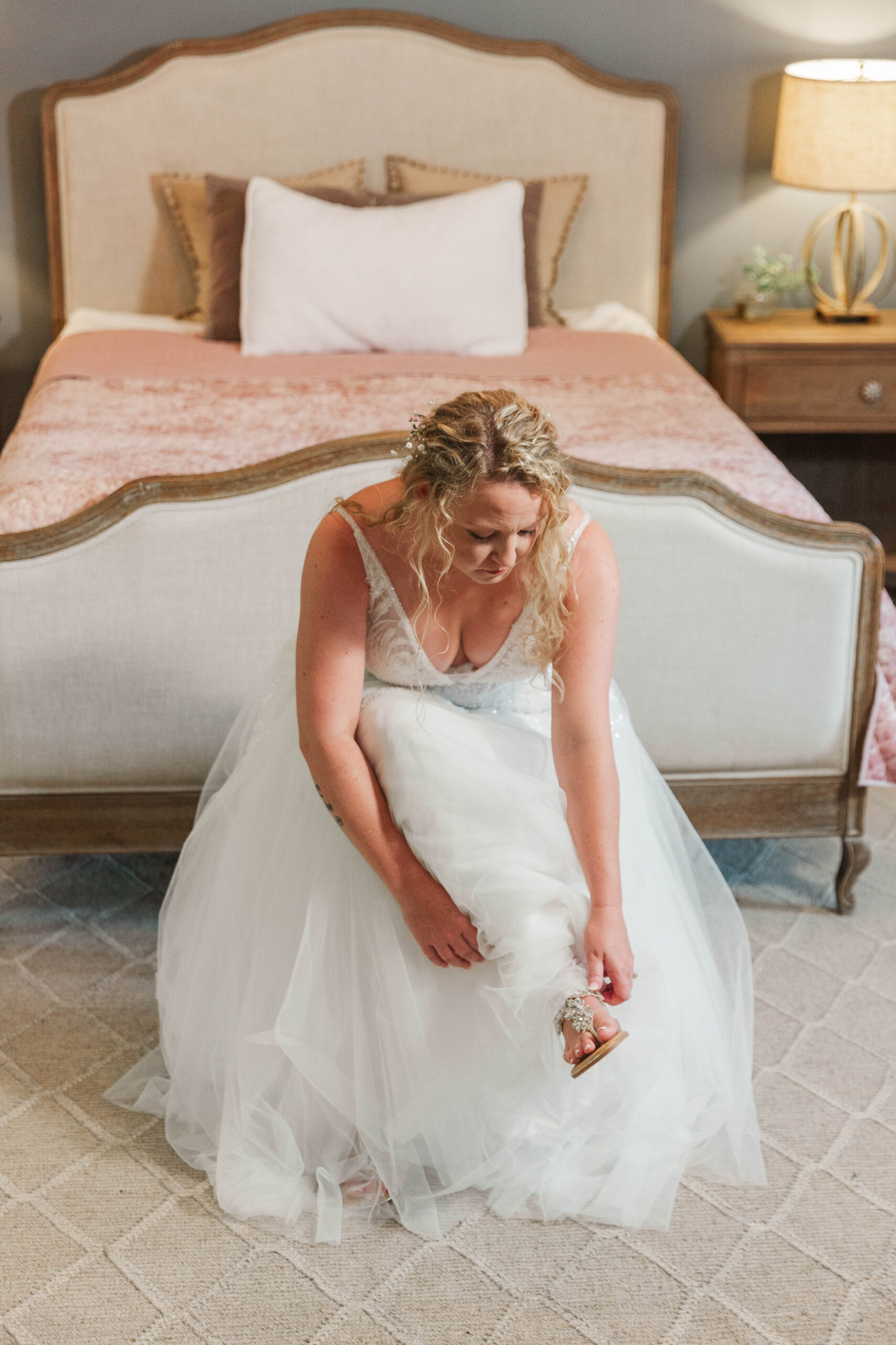 Bride putting on shoes