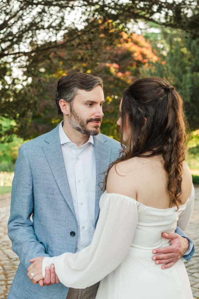 engaged couple dancing in Japanese Garden at Maymont