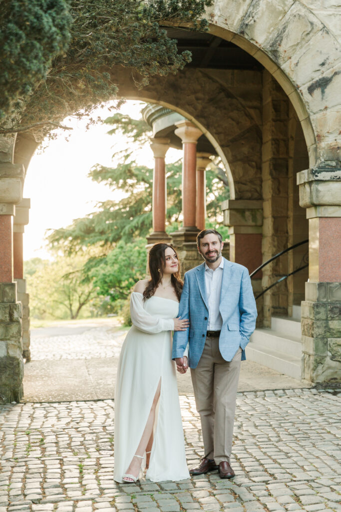 engagement session at arch in front of Maymont Mansion