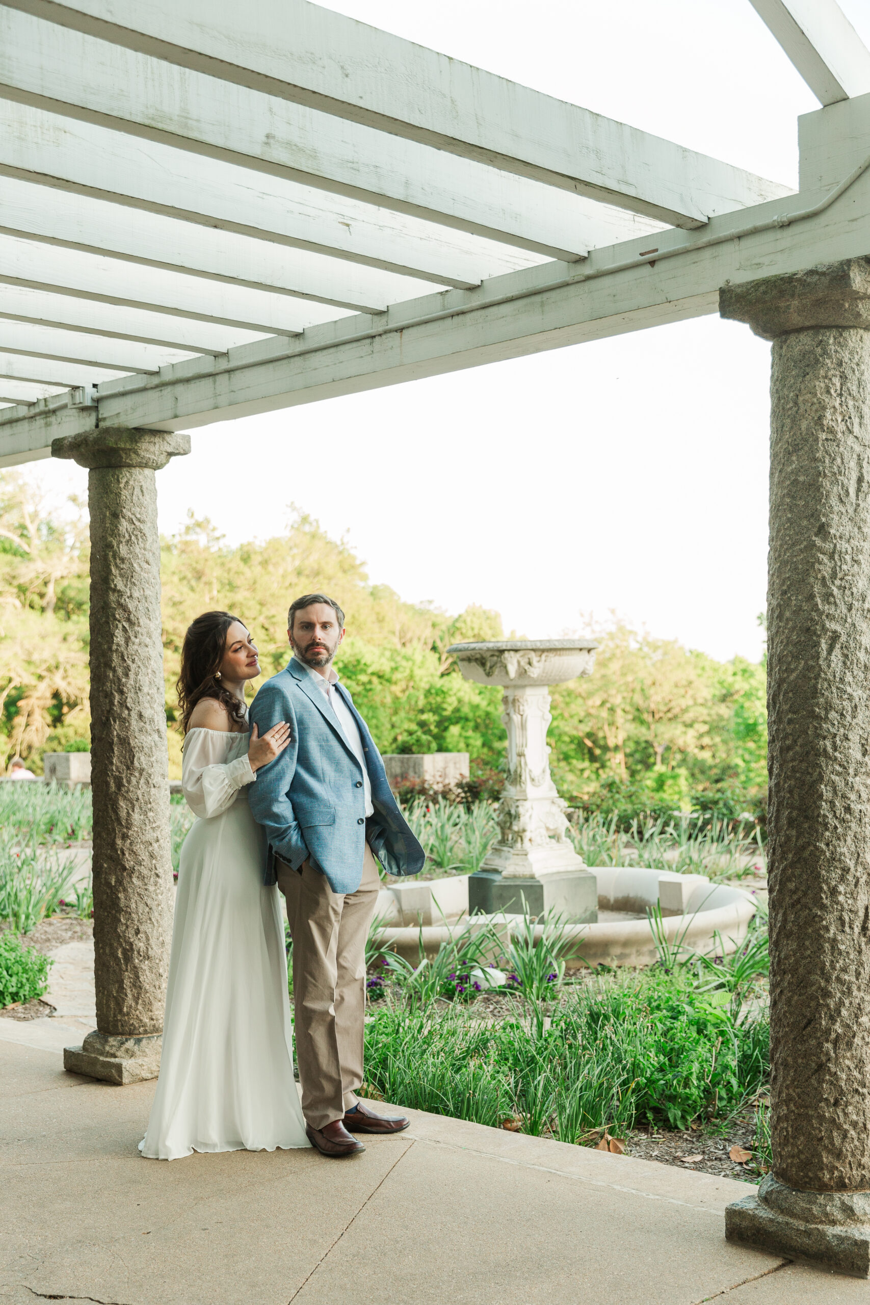 couple standing by fountain in Italian Garden