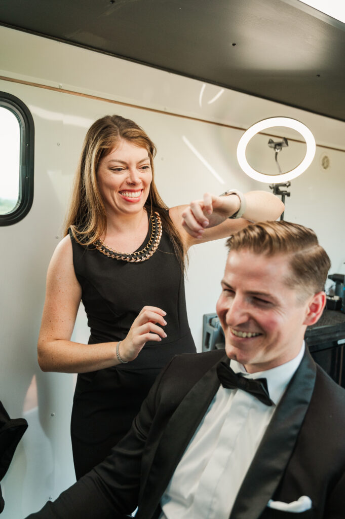 groom getting hair touched up before wedding - Shear Movement Barbershop