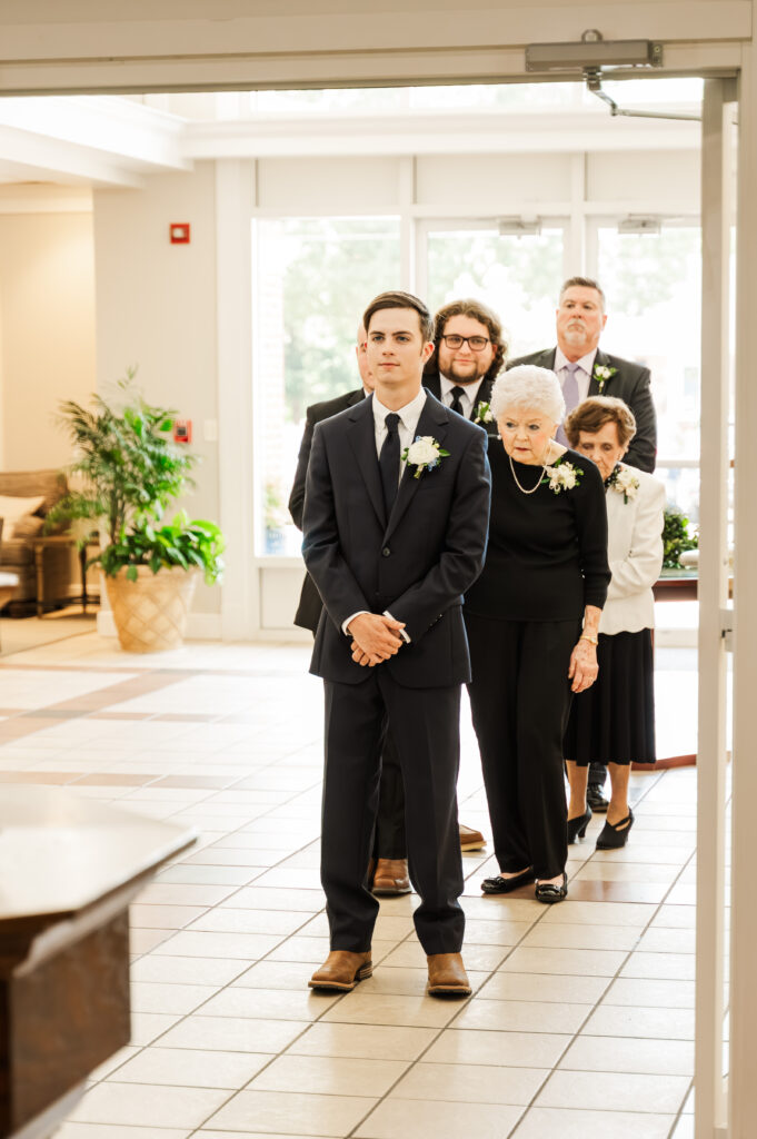 groom waiting to enter ceremony