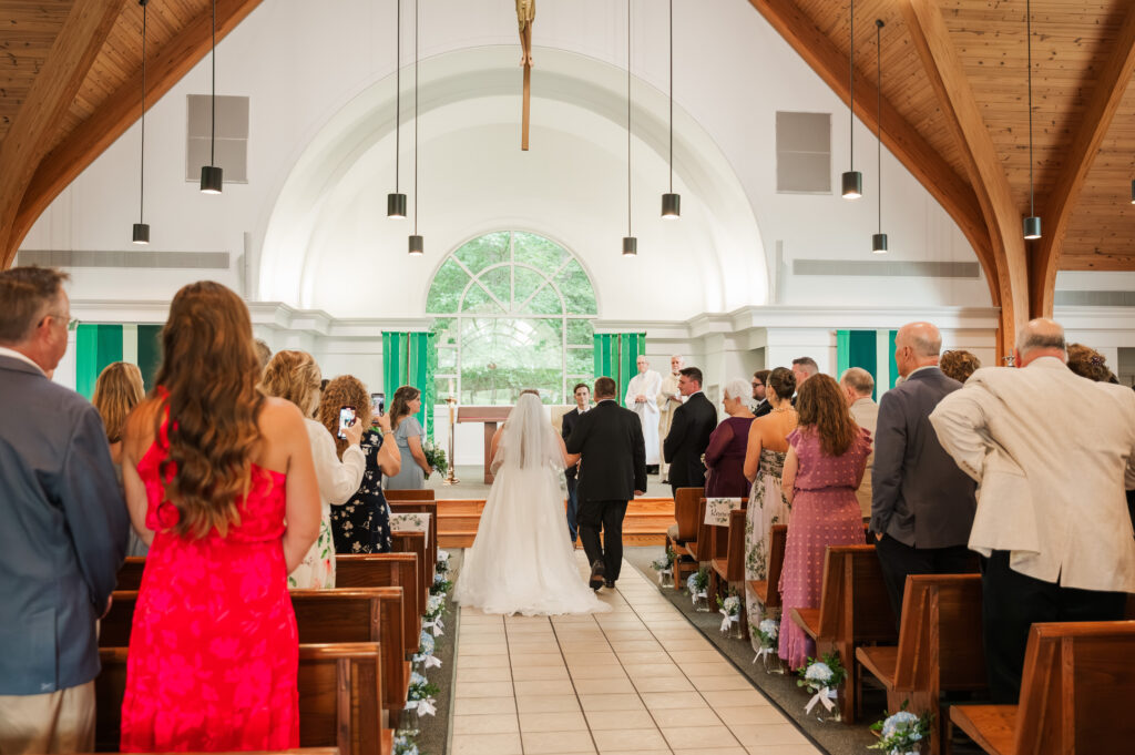 father walking bride down aisle