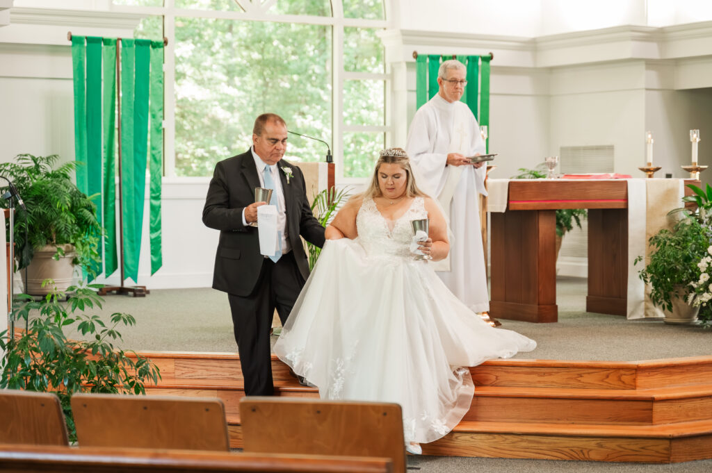 father and bride prepare for communion