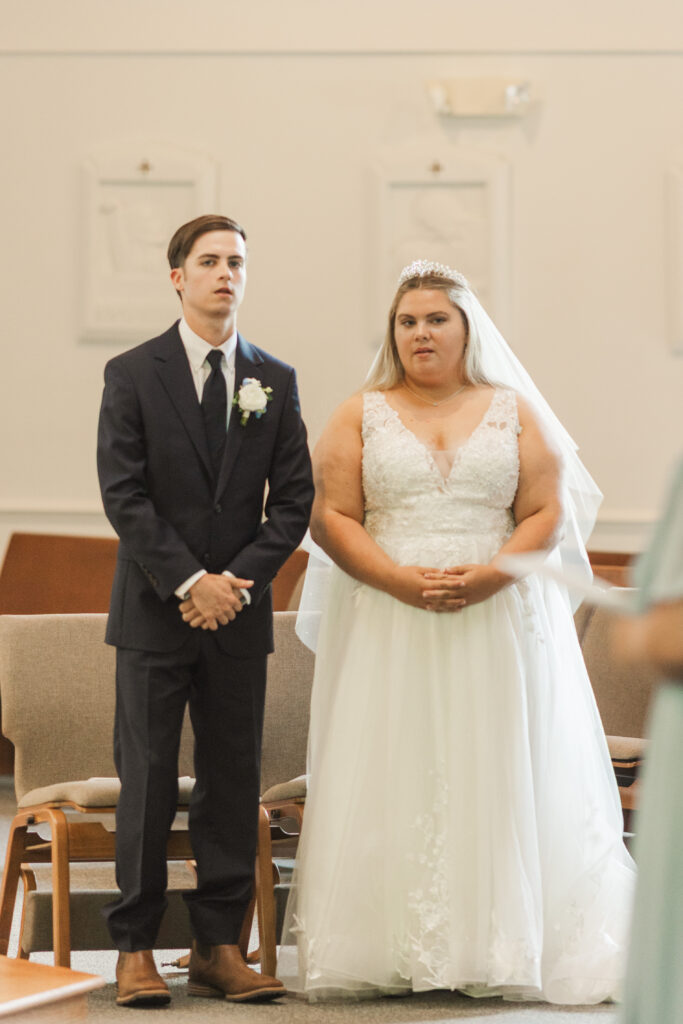 bride and groom at catholic wedding cermony