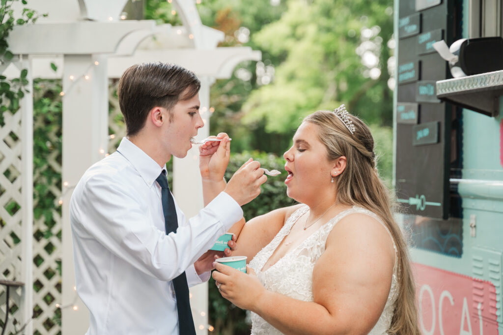 bride and groom at ice cream truck for wedding dessert