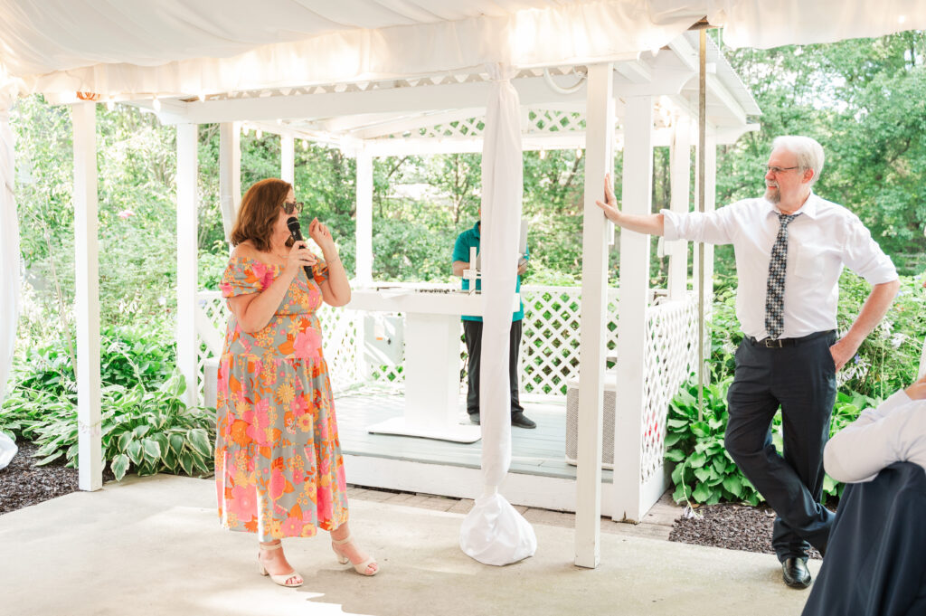 winner of anniversary dance giving advice to bride and groom