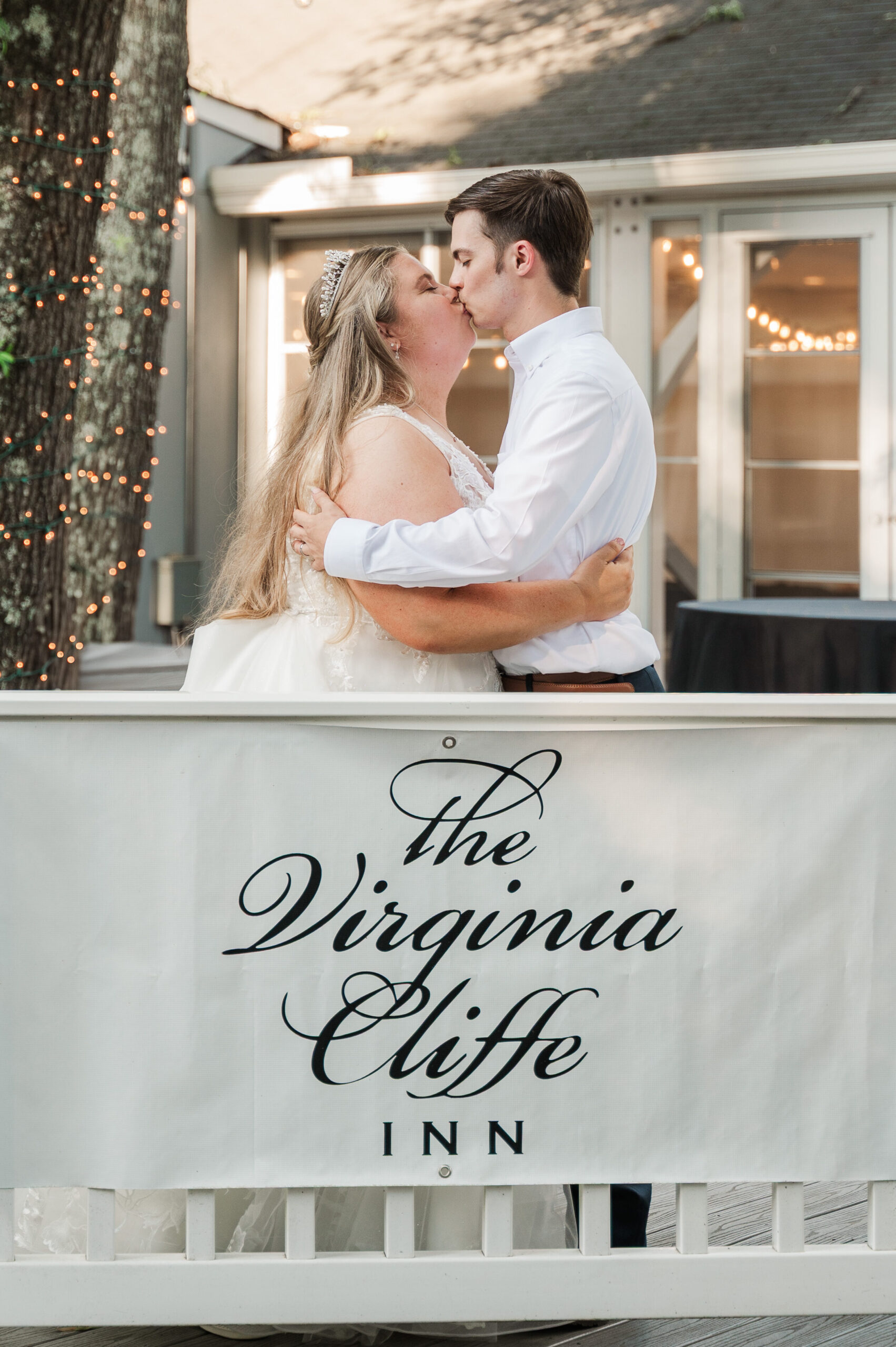 bride & groom with sign for Virginia Cliffe Inn