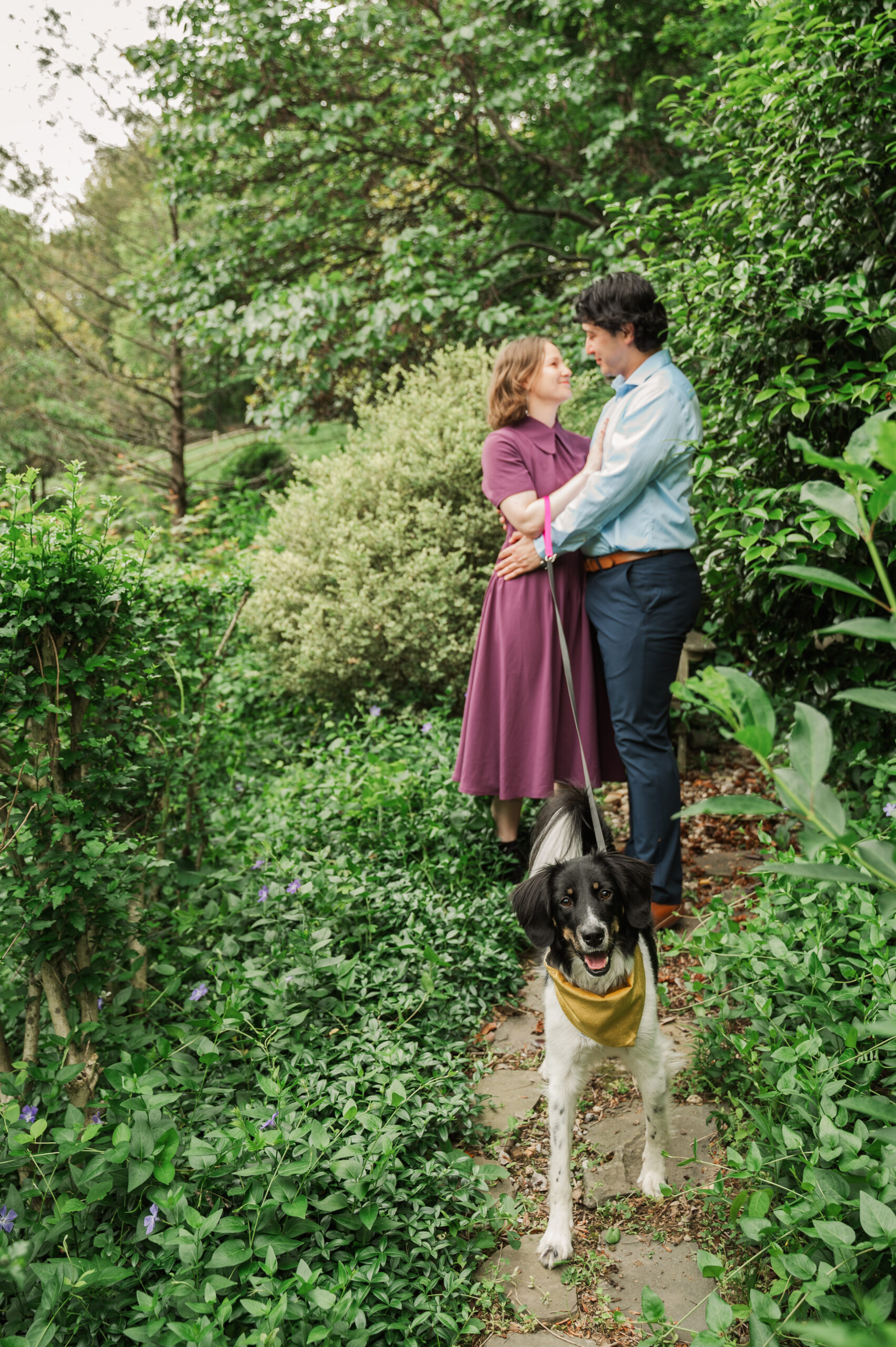 Chelsea and Alex posing with their dog Sidney at Alex’s mom’s house before their Huntley Meadows engagement photos.
