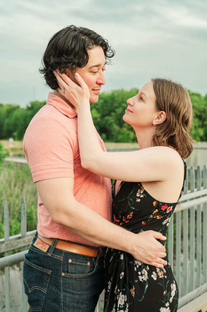 Engaged couple together in golden evening light at Huntley Meadows Park.