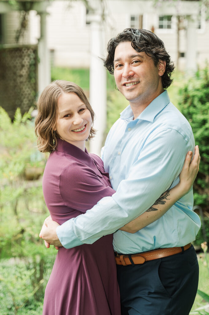 engaged couple embracing 