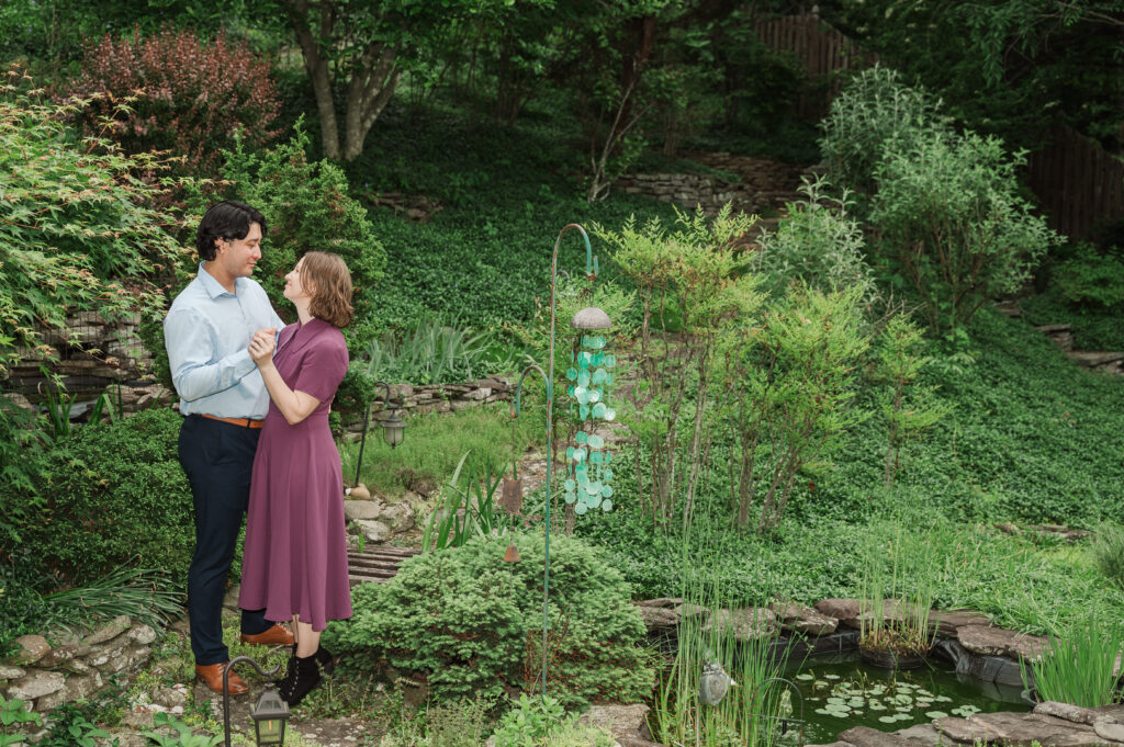Chelsea and Alex dancing at Alex’s mom’s house by the fish pond.