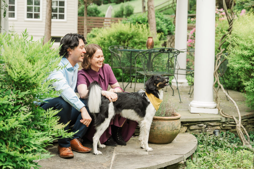 Chelsea and Alex sitting with their dog Sidney at Alex’s mom’s house before their Huntley Meadows engagement photos.