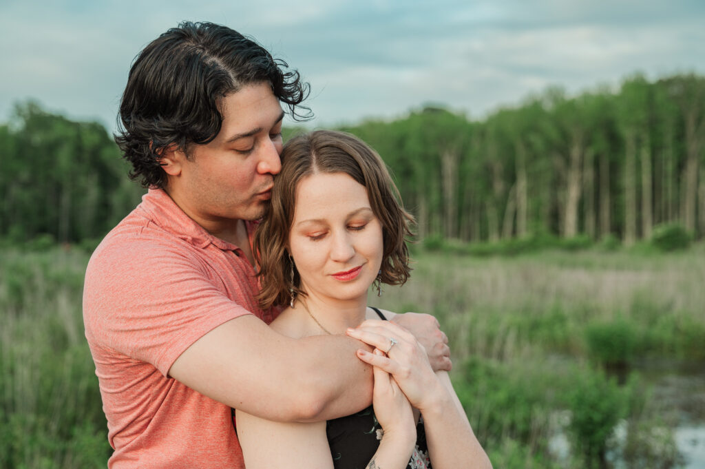 Romantic photo of Chelsea and Alex together at Huntley Meadows Park.
