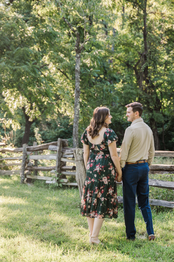 couple standing at fence