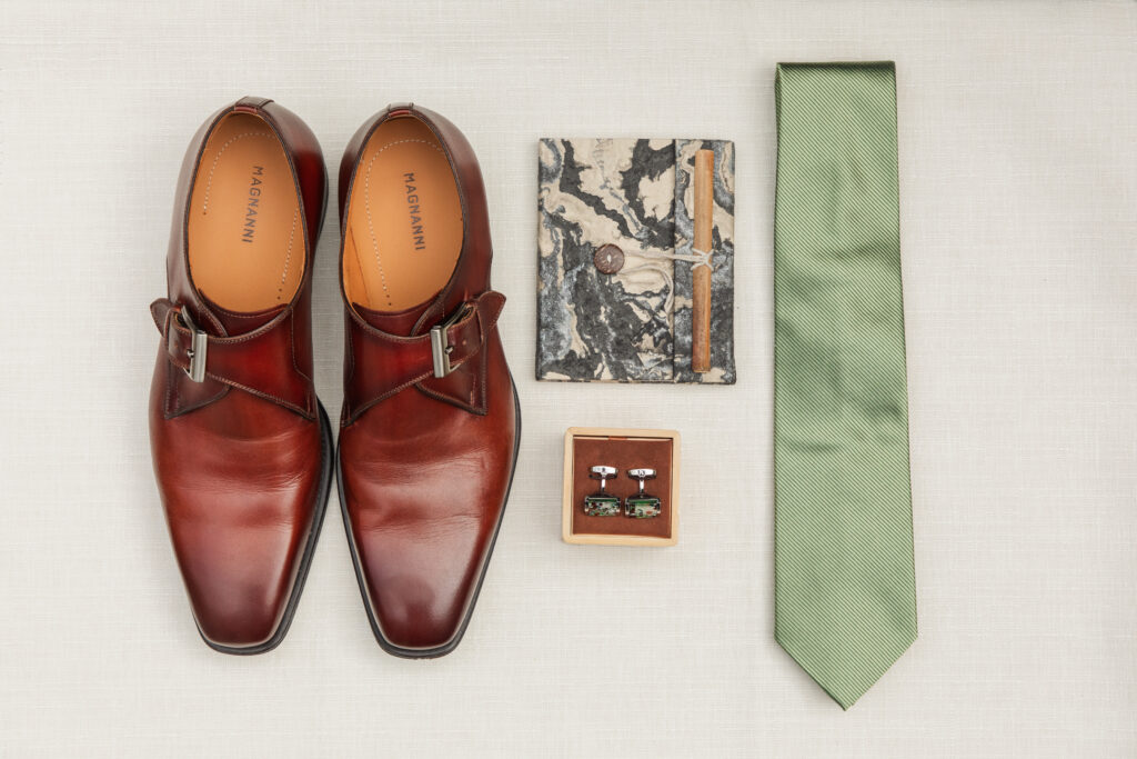 flatlay of groom's details