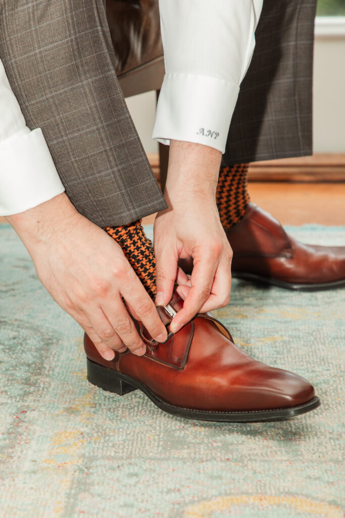 groom putting on shoes