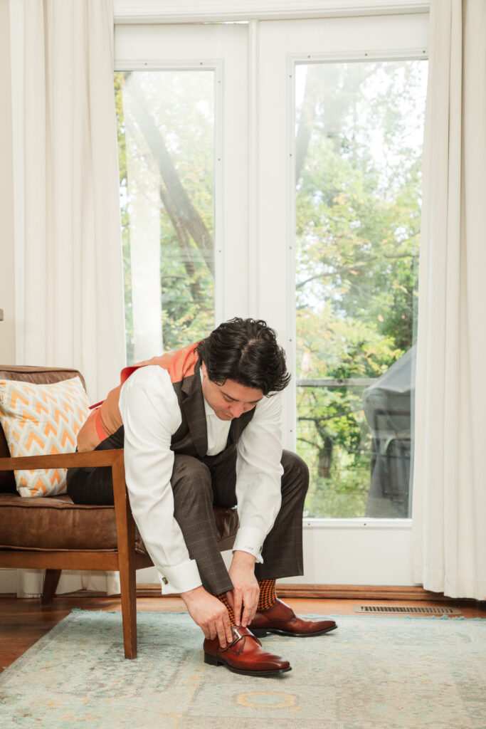 groom putting on shoes