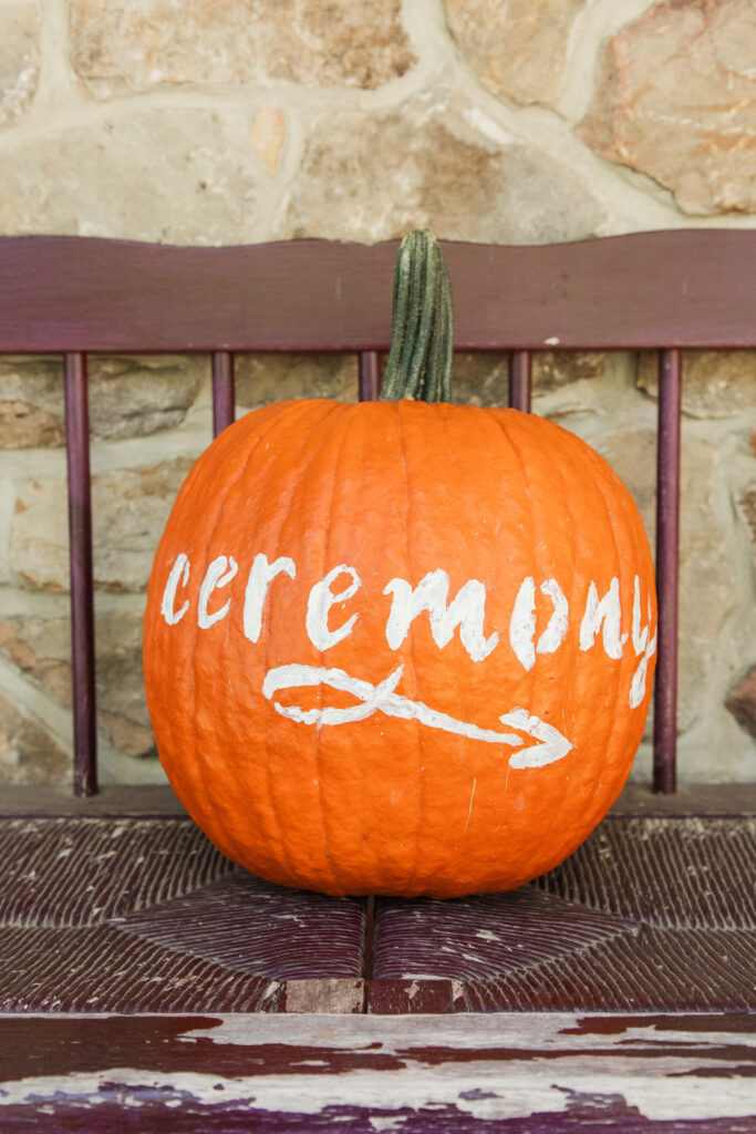 pumpkin with ceremony directions painted on it