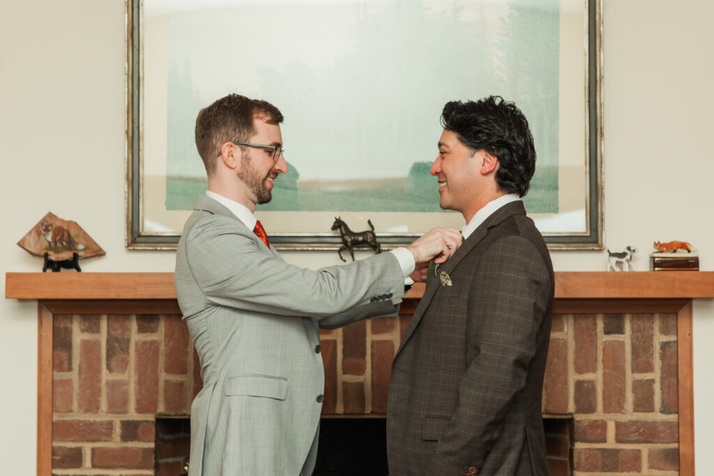 best man helping groom get ready