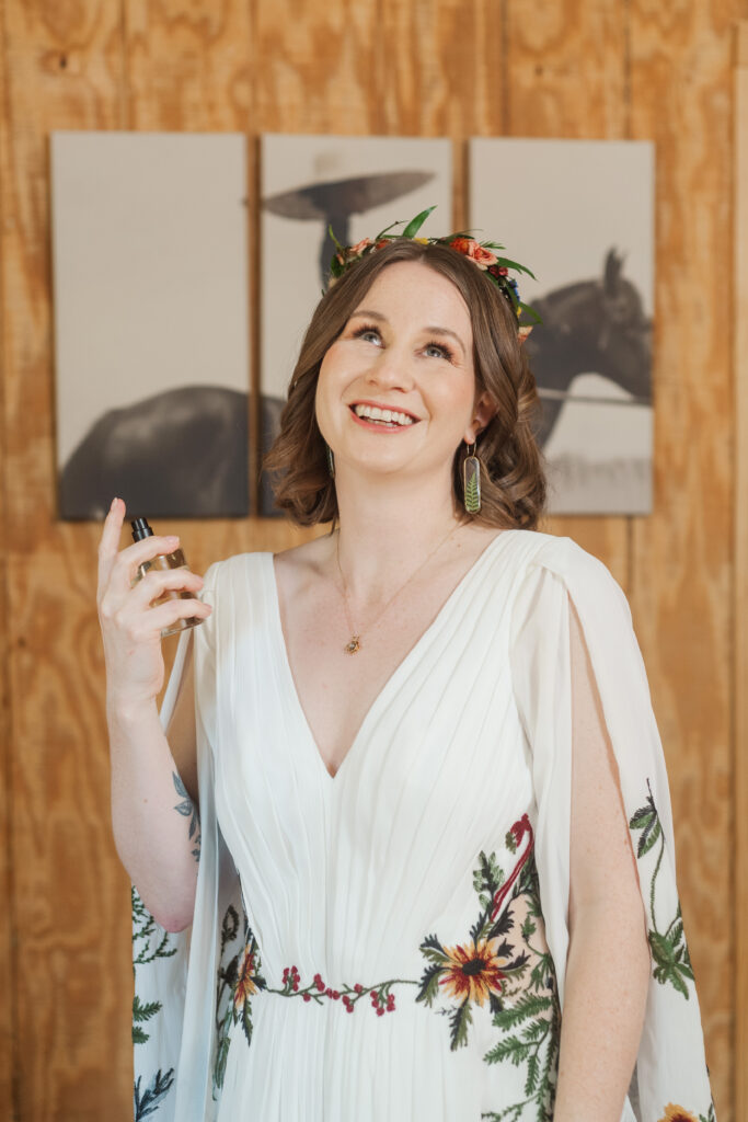 bride putting on perfume
