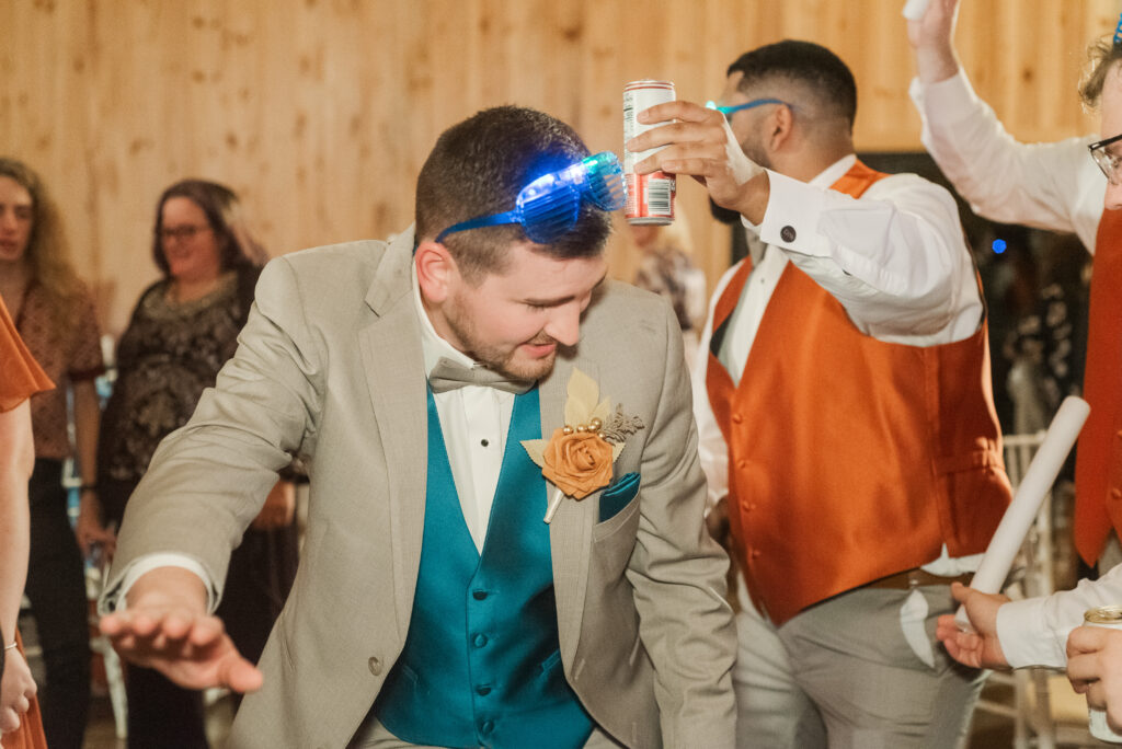 groom dancing at reception