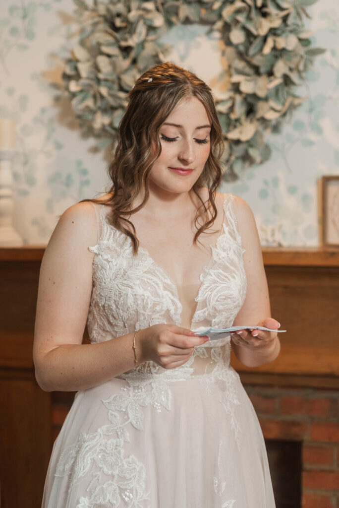 Bride McKenzi while getting ready before her wedding at Valley Mills Farm.
