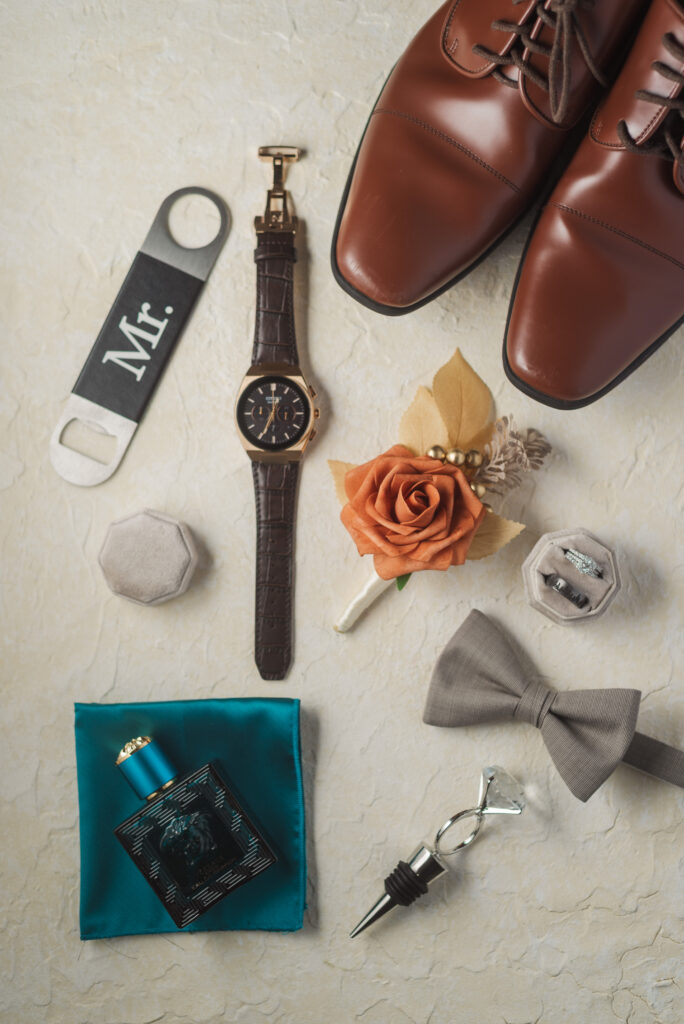 flatlay of groom's details