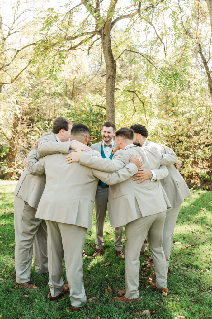 groom and groomsmen in huddle