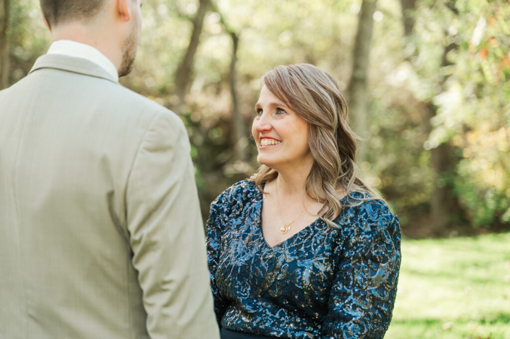 Groom and Mom first look by the river