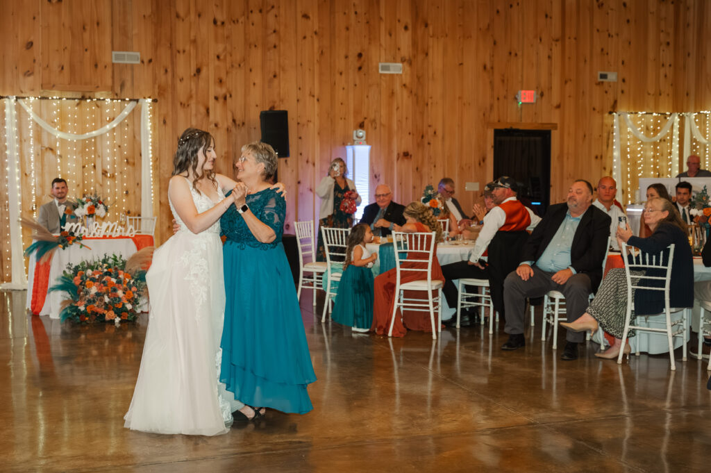 bride dancing with mom