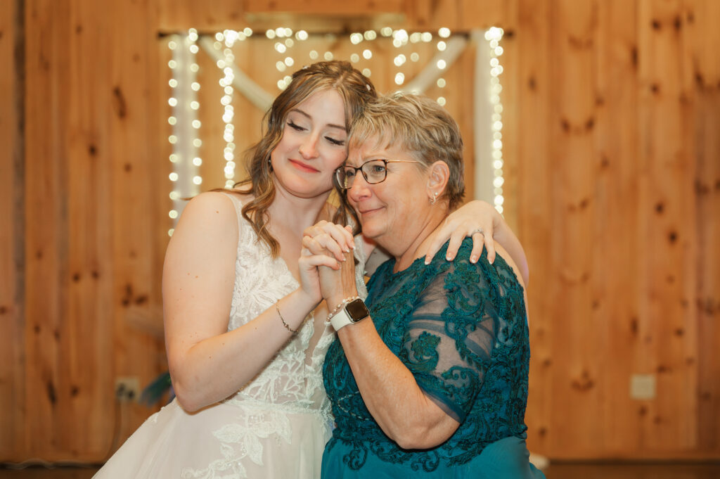 bride dancing with  mom