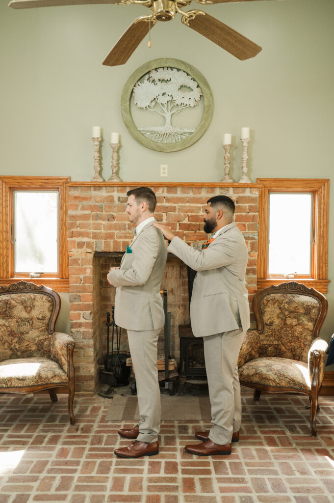 groom putting on jacket