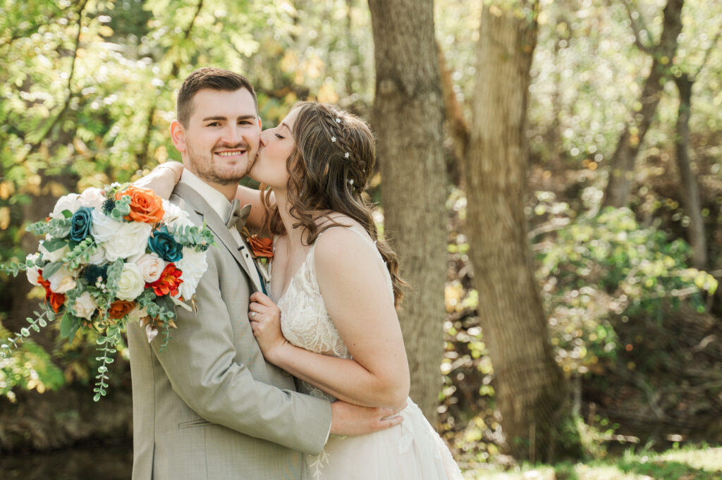 bride kissing groom's cheek