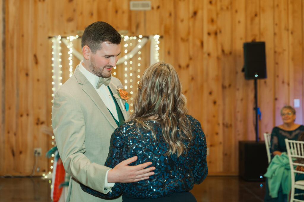 groom dancing with mom