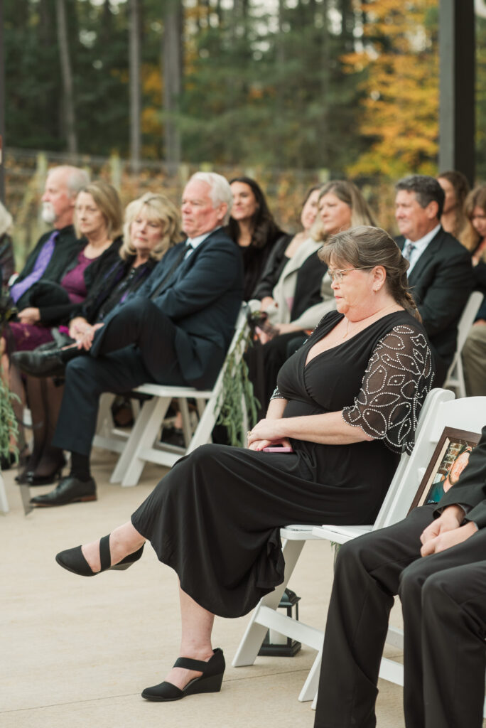 mother of groom sitting at ceremony