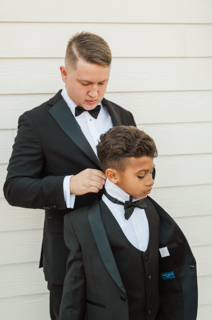groom helping son getting ready
