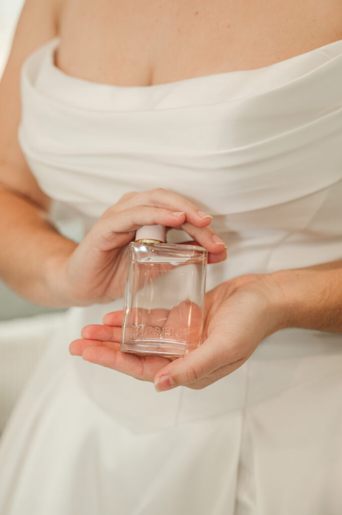 perfume in bride's hands