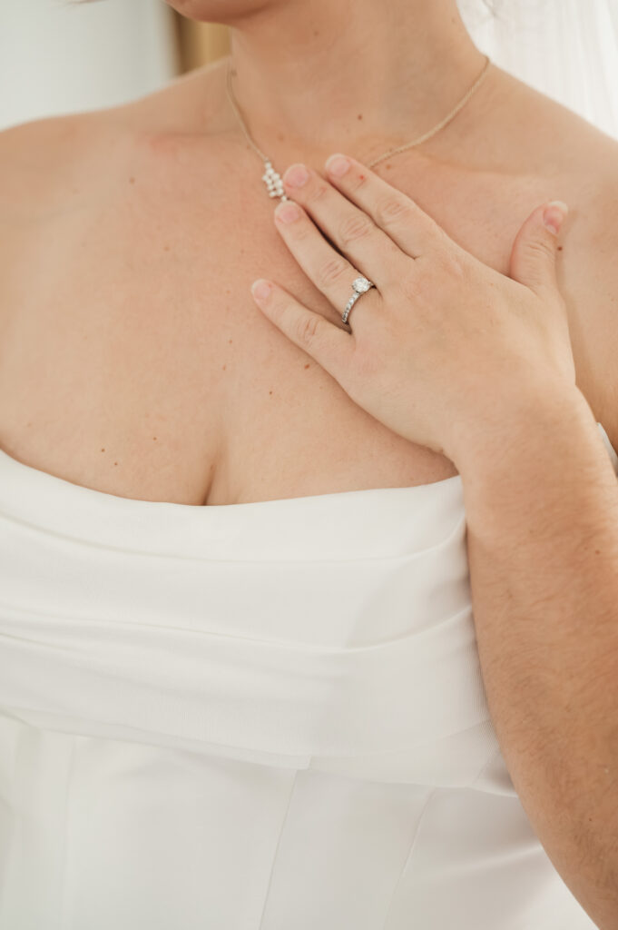 close up of necklace on bride's neck