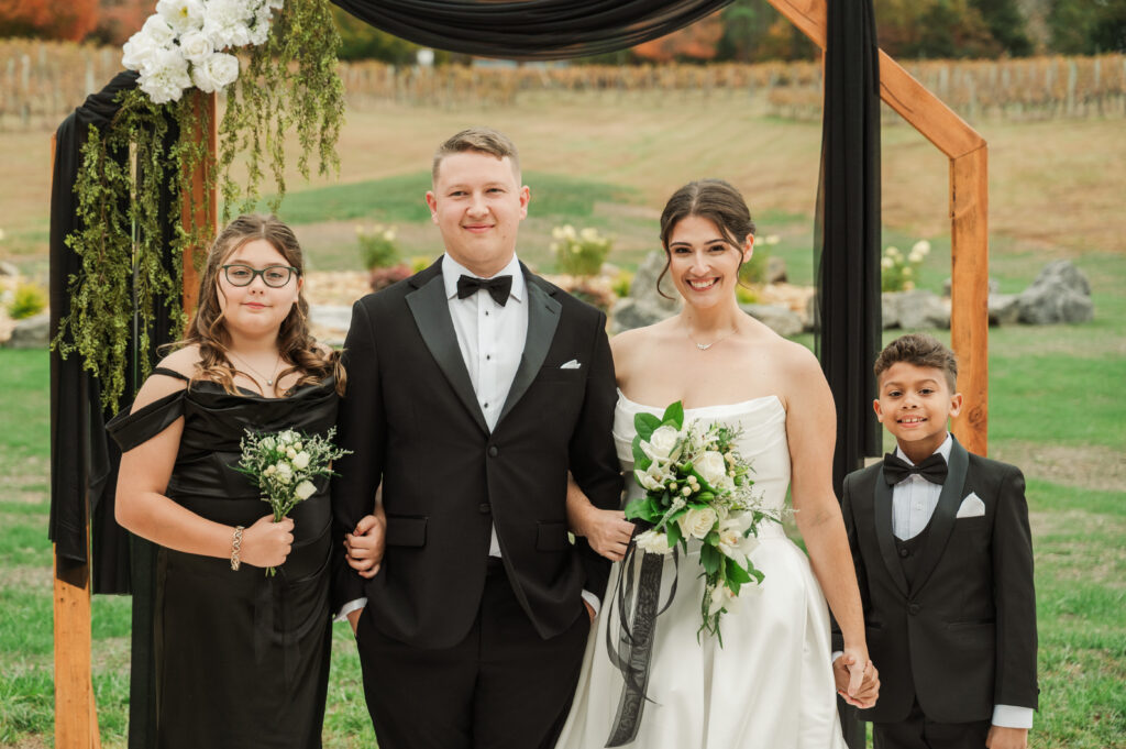bride and groom with their children