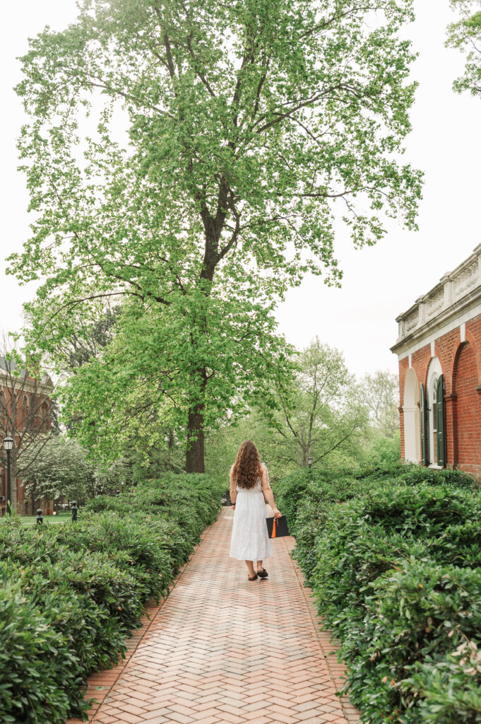Emily walking on sidewalk at UVA